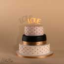 gâteau de mariage noir blanc et or